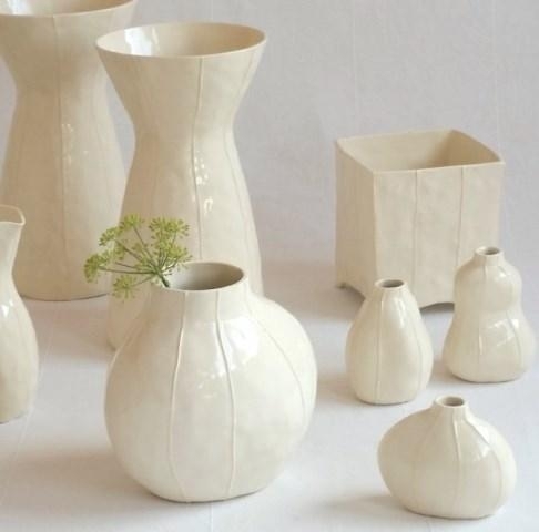 White ceramic vases with simple morderrn style by kRI kRI Studio